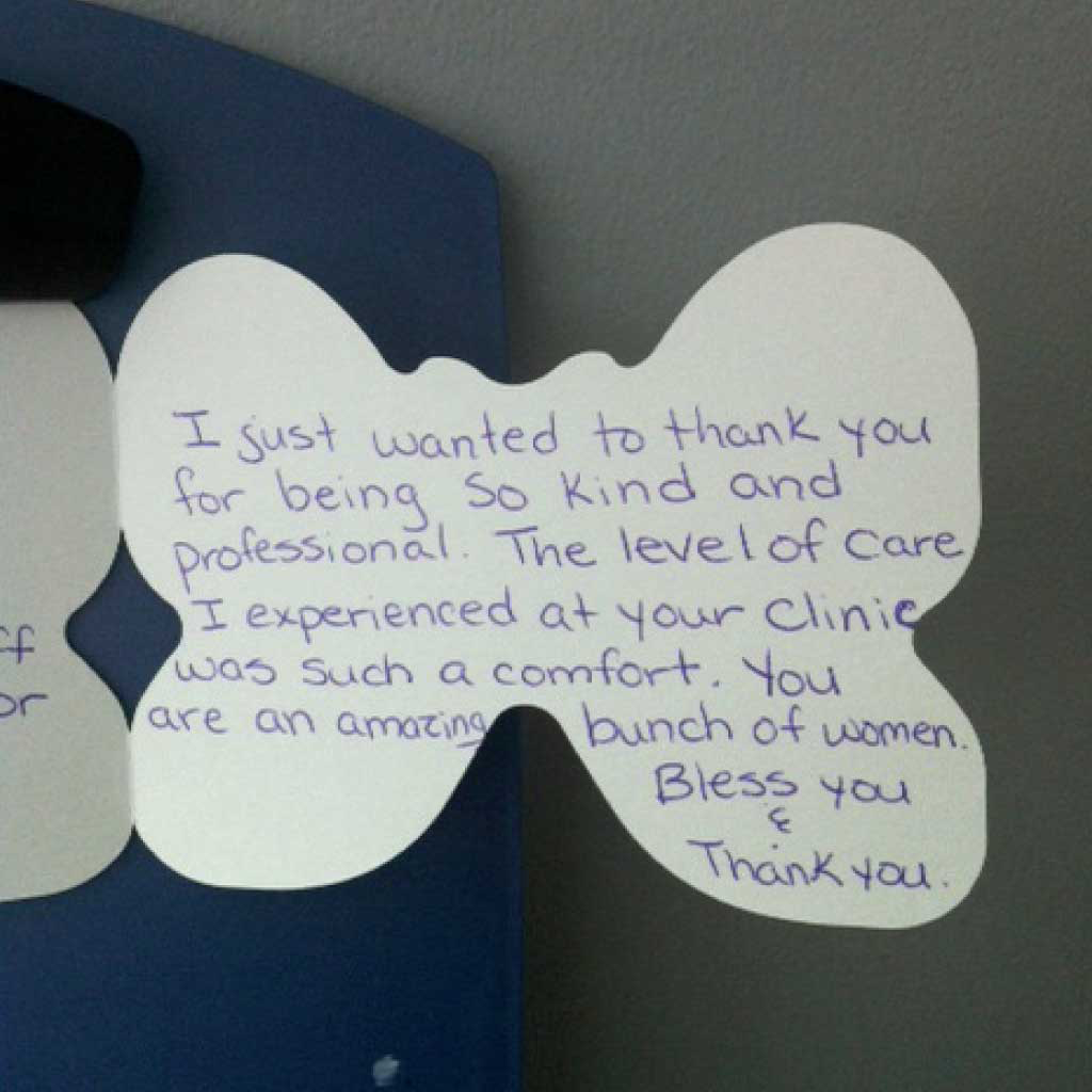 Butterfly-shaped handwritten thank you note from a grateful patient at Brampton Women's Clinic.